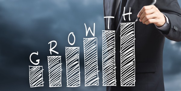 Man drawing growth bar chart
