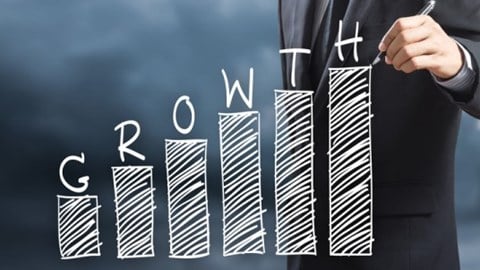Man drawing growth bar chart