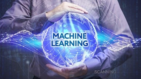 Man holding abstract globe with wavy lines and connection points and the words MACHINE LEARNING with 0 and 1 digits behind