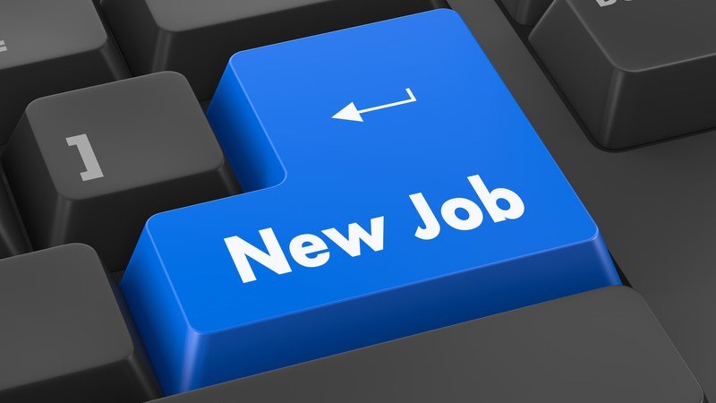 New Job Written on a Blue Key on a Gray Computer Keyboard