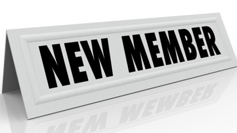 New member table card sign reflecting on shiny white surface