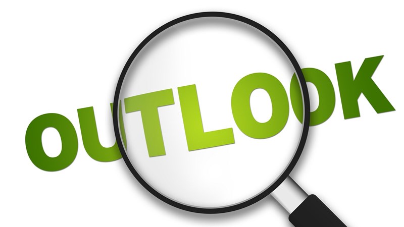 The word OUTLOOK written in green as seen through a magnifying glass