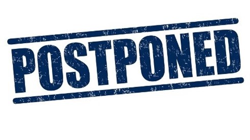 The Word Postponed Rubber Stamped in Blue