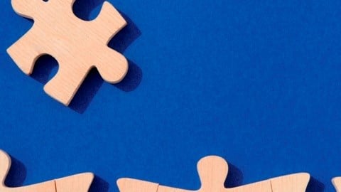 Wooden puzzle pieces on a blue background