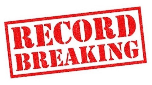 RECORD BREAKING in red letters in a red rectangle