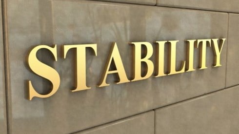 The word STABILITY on a ceramic building wall