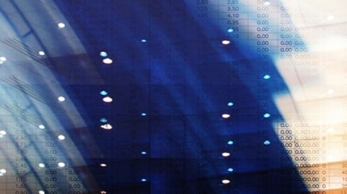 An abstract of statistics and numbers in columns on documents with layers of blue and orange shading above the statistics