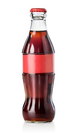 A glass soda bottle with a plain red label with no visible writing and a red cap containing brown liquid