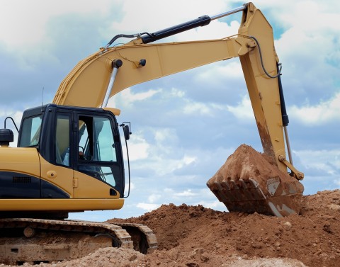 Excavator digging dirt