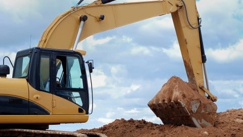 Excavator digging dirt