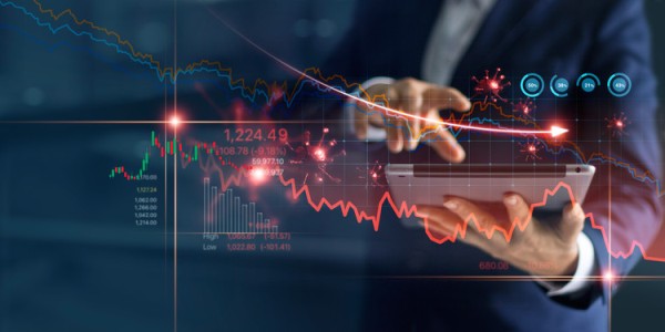 Businessman uses tablet to analyze COVID19 economic fallout data