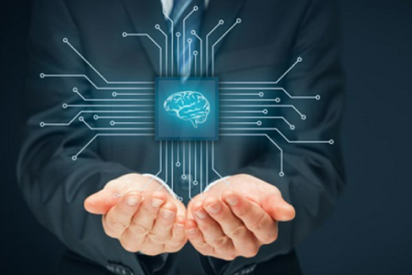 Businessman holding an enlarged microchip with a human brain