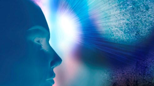Abstract CGI bhlue human head with light shooting from forehead