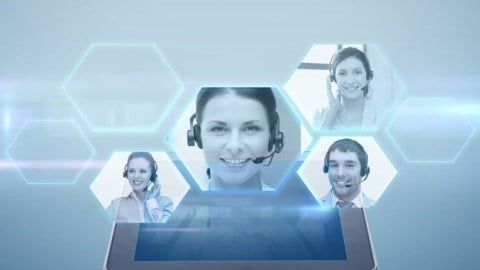 A tablet with virtual screens floating above it showing several businesspeople with headphones