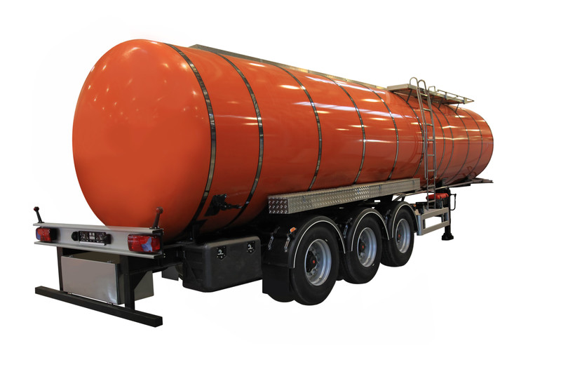 Three quarter angle shot of an orange fuel tank trailer 