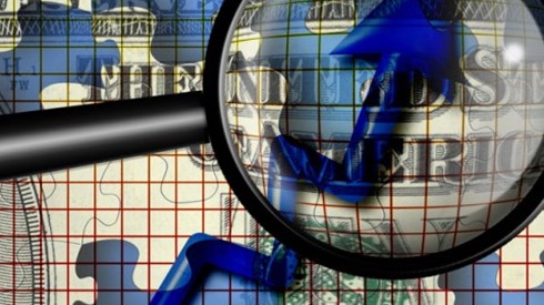 A magnifying glass looking at an increasing blue arrow with a dollar puzzle piece background