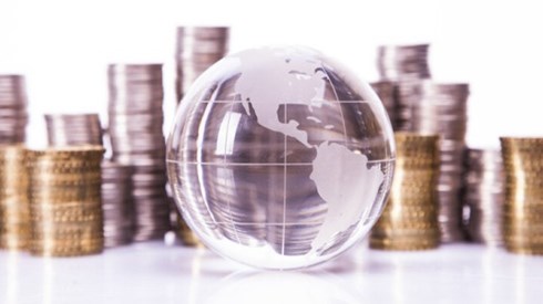 Clear Globe with Stacks of Coins in the Background
