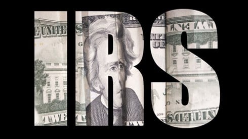 IRS Lettered with $20 bill on black background