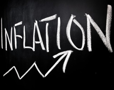 Arrow on chalkboard showing increase under written word inflation