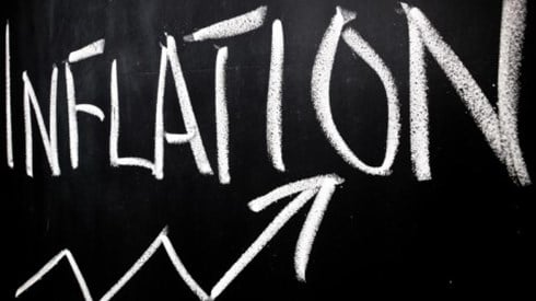 Arrow on chalkboard showing increase under written word inflation