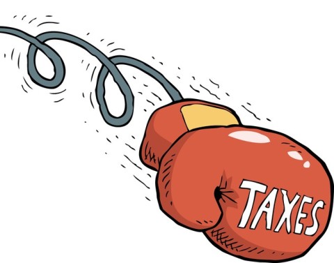 Moving boxing glove displaying the word taxes