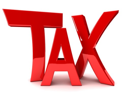 The word TAX in red glossy letters