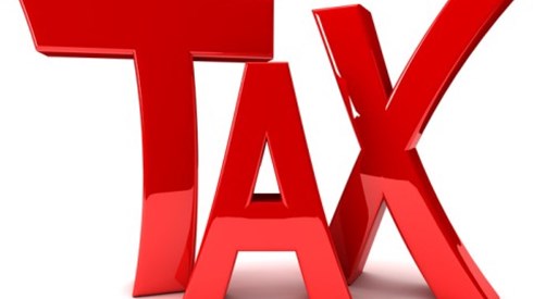 The word TAX in red glossy letters