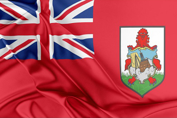 The Bermuda flag with bunched red fabric on a black background
