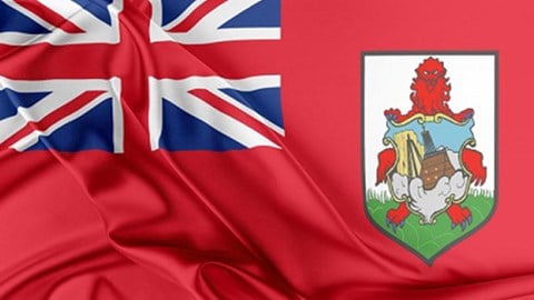 The Bermuda flag with bunched red fabric on a black background