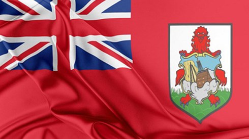 The Bermuda flag with bunched red fabric on a black background