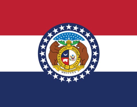 The flag of Missouri has three equal horizontal stripes of red, white, and blue with the coat of arms in the center.