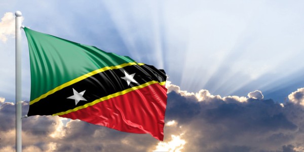 The Saint Kitts and Nevis flag has a diagonal yellow-edged black band with 2 stars and green upper and red lower triangles