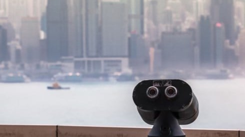 Coin operated binoculars with waterfront view of Hong Kong City