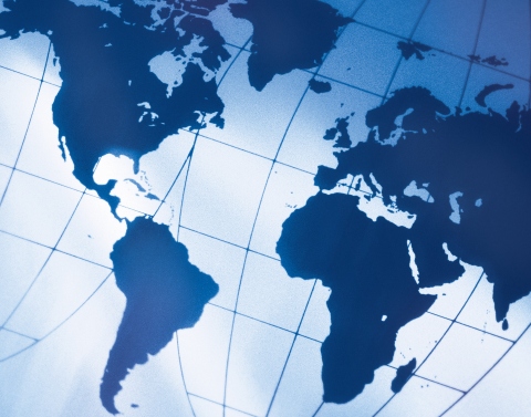 Goode world map in blue at a diagonal angle 