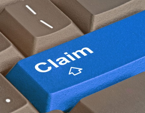 A blue key on a grey keyboard reading claim
