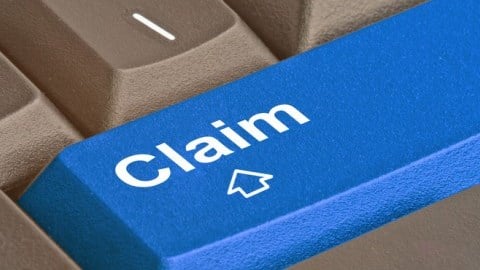 A blue key on a grey keyboard reading claim