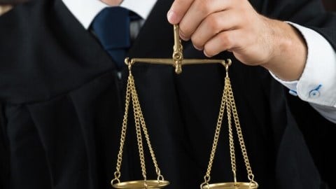 Arbitration Judge With Scales Of Justice