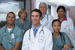 Group photo diverse doctors and nurses in a hospital in teal scrubs and white coats