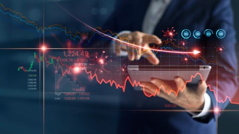 Businessman uses tablet to analyze COVID19 economic fallout data