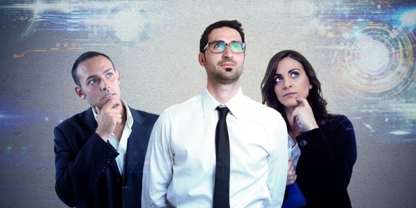 Three business professionals contemplating future technology