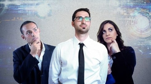 Three business professionals contemplating future technology