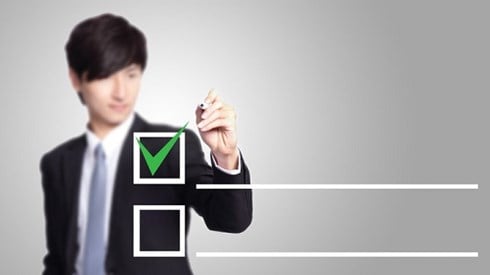 Businessman checking check box