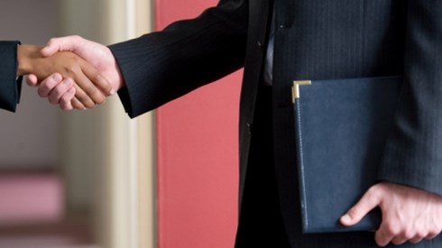 Two businesspeople shaking hands