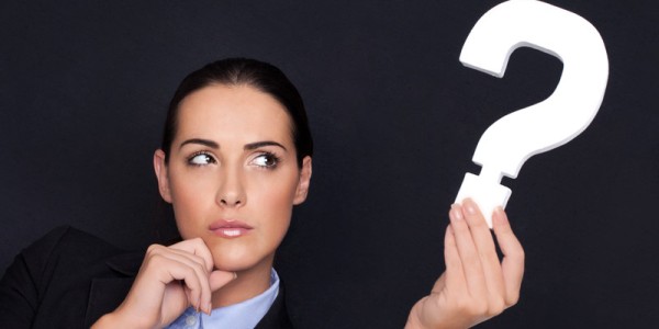 Businesswoman Holding A Question Mark