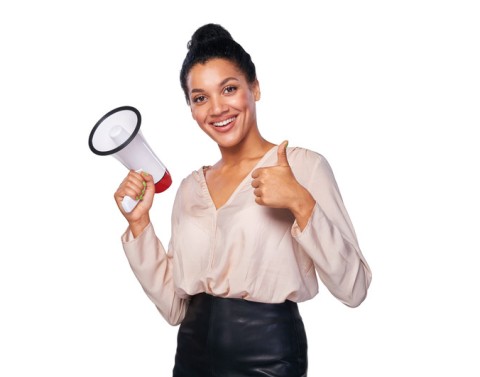 Businesswoman with megaphone giving thumbs up