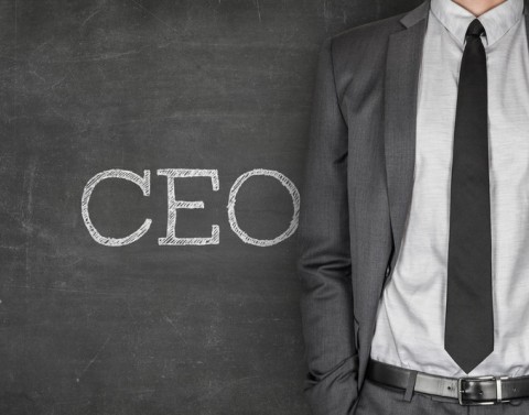 CEO Written On Chalkboard Next To Businessman