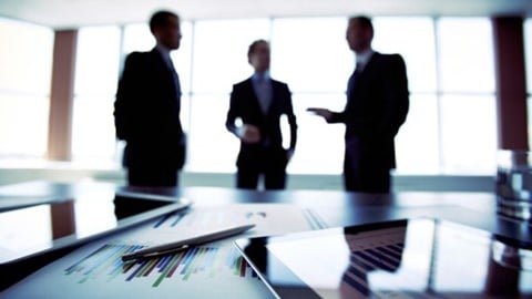 Silhouettes of three businessmen at a planning meeting