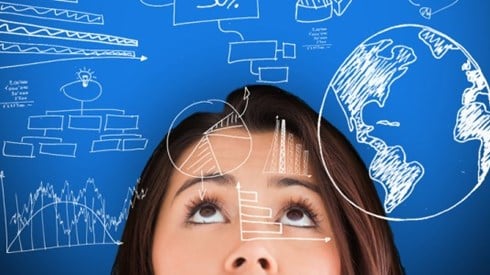 Woman looking up with charts and drawings on blue background and superimposed on her face
