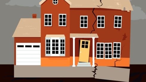 Land problems cause a foundation to partially separate from a home and create a crack from base to roof and a smaller crack