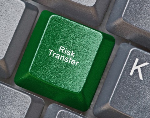 On a black computer keyboard, the J key is green and replaced with the words Risk Transfer.